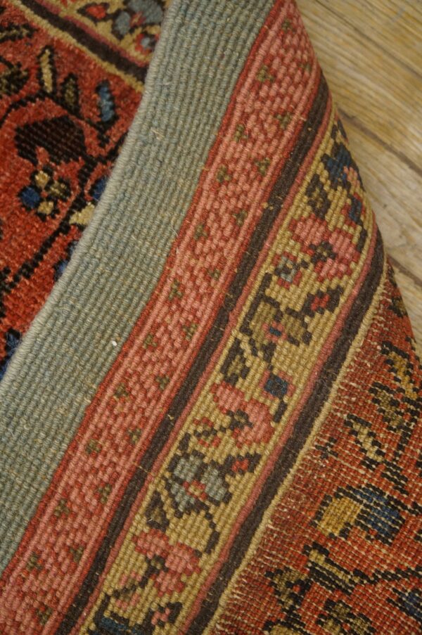 Close-up of the rolled edge of a richly colored rug showing warp and weft texture by rugs on net