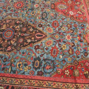 Close-up of a vintage blue and red floral area rug by Rugs On Net. by Rugs On Net