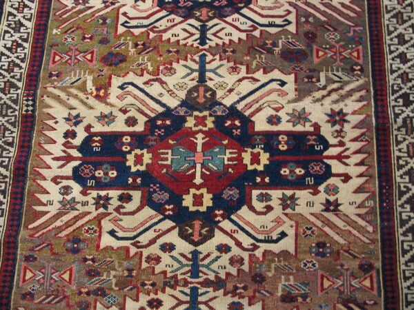 Close-up of a colorful, geometric oriental rug pattern by rugs on net