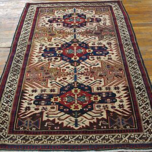 A long, narrow tribal rug with geometric patterns in red, blue, and cream colors, by Rugs On Net. by Rugs On Net