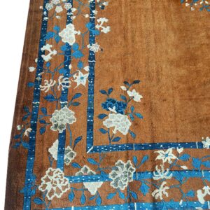 Close-up of a brown rug with blue and white floral border detail, by Rugs On Net