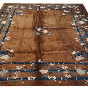 Brown rug with blue and white floral border, Oriental design by Rugs On Net
