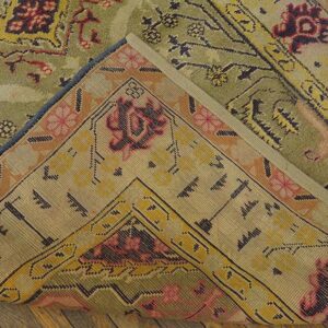 Close-up showing the backing of a green and pink patterned rug, by Rugs On Net. by Rugs On Net