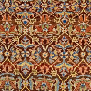 Close-up detail of a richly colored, dark brown antique rug with intricate floral and vine motifs in reds, blues, and yellows, by Rugs On Net