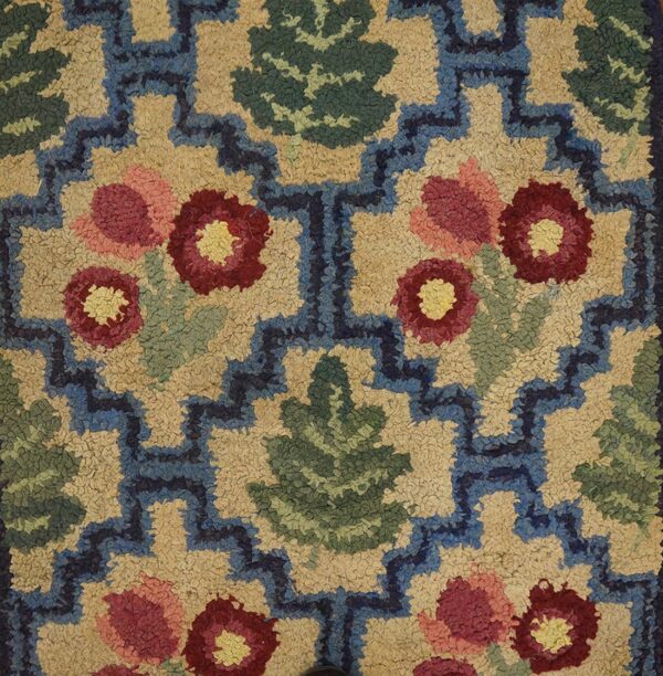 Close-up of a colorful floral and geometric hooked rug pattern by rugs on net