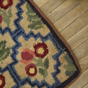 Close-up of a colorful floral hooked rug detail by Rugs On Net. by Rugs On Net