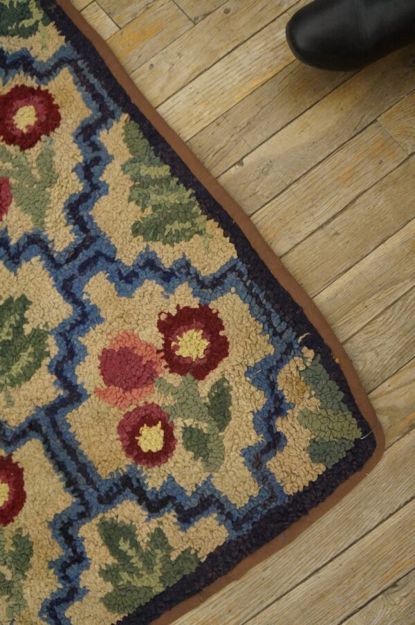 Close-up of a colorful floral hooked rug detail by rugs on net. By rugs on net