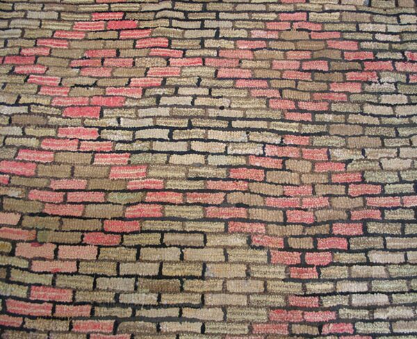 Close-up of a rug with a brick pattern in red and tan shades, by rugs on net