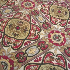Close-up of a richly patterned rug featuring red, gold, and black medallions by Rugs On Net