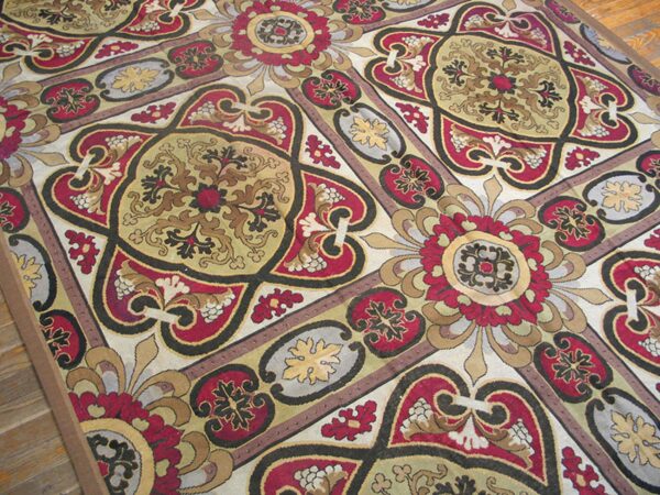 Close-up of a richly patterned rug featuring red, gold, and black medallions by rugs on net