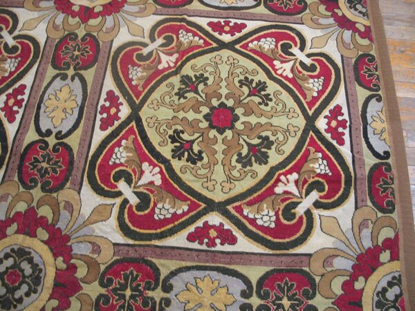 Close-up of a richly colored rug featuring intricate medallion patterns in red, gold, and black by rugs on net