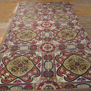 Long runner rug with intricate red, gold, and black medallion pattern on wood floor by Rugs On Net