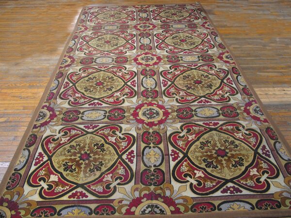Long runner rug with intricate red, gold, and black medallion pattern on wood floor by rugs on net