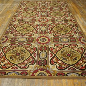 Long runner rug with repeating ornate medallions in red, gold, and black on a light background, by Rugs On Net