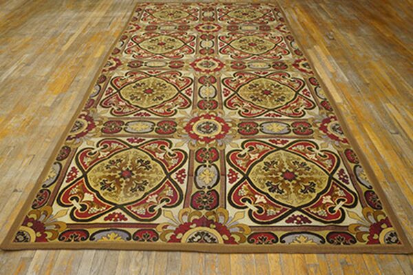 Long runner rug with repeating ornate medallions in red, gold, and black on a light background, by rugs on net