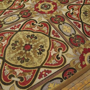 Close-up of a richly patterned tapestry rug with red, gold, and black motifs, by Rugs On Net. by Rugs On Net