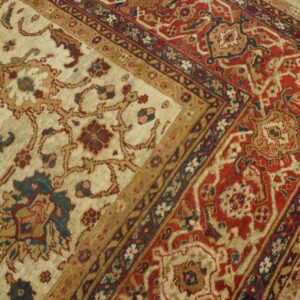 Close-up of a cream field with floral motifs and a rich red border on the Persian Rug by Rugs On Net. by Rugs On Net