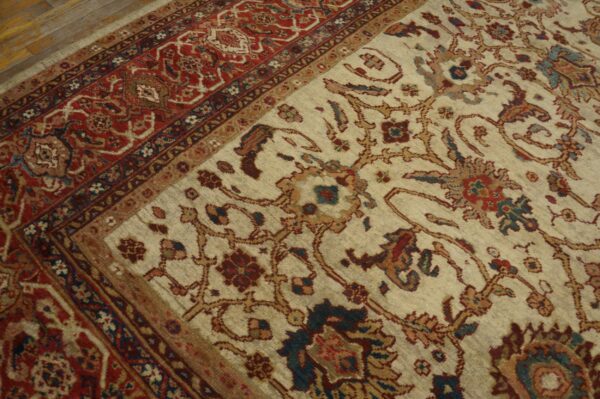 Close-up of a light field rug with intricate floral patterns and a detailed red border by rugs on net. By rugs on net