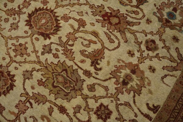 Close-up of a beige and brown floral patterned rug by rugs on net. By rugs on net