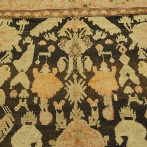 Close-up of a tribal rug with dark brown and beige motifs, by Rugs On Net