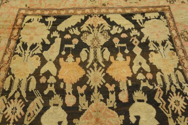 Close-up of a tribal rug with dark brown and beige motifs, by rugs on net