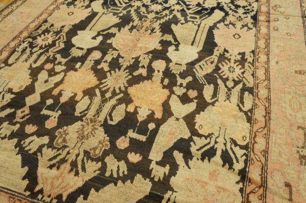 Close-up of a tribal rug with dark brown and beige motifs by rugs on net