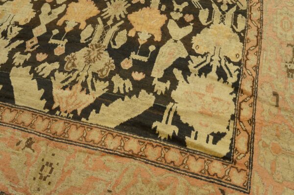 Close-up of a tribal rug with dark field and geometric motifs in cream and peach tones by rugs on net