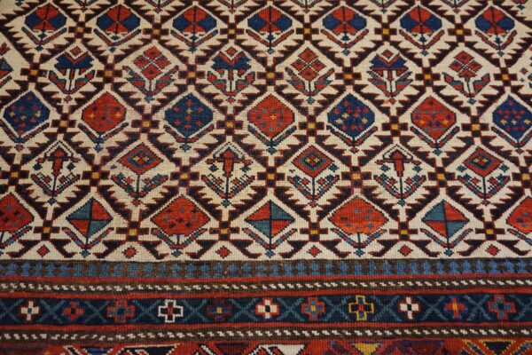 Close-up of the geometric pattern on the caucasian rug by rugs on net. By rugs on net