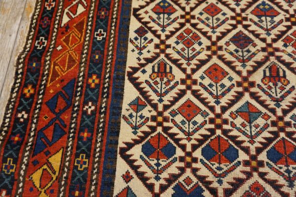 Close-up of geometric patterns and rich colors on the caucasian rug by rugs on net. By rugs on net