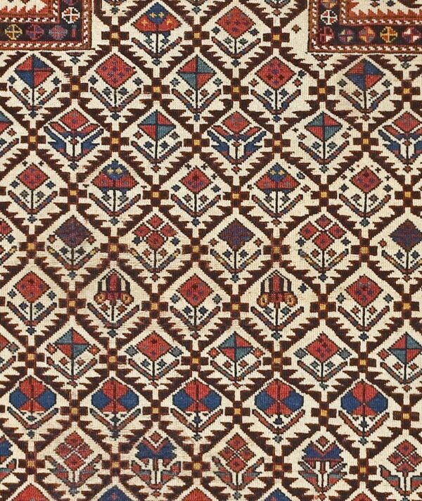 Close-up of a geometric caucasian rug pattern with diamond motifs by rugs on net