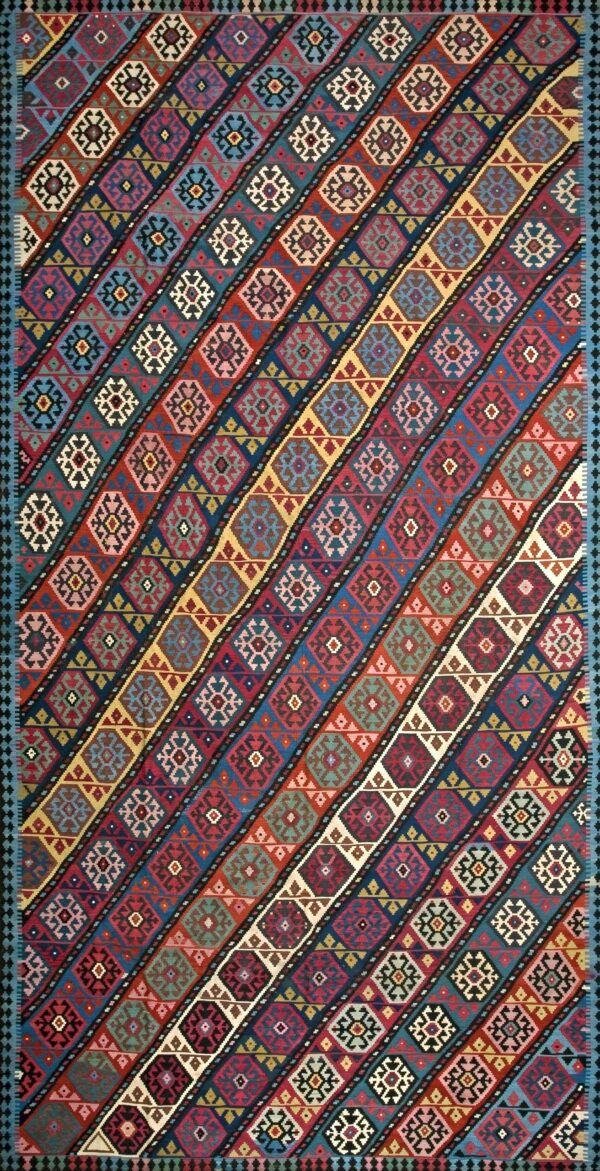 Late 19th century flat weave kilim featuring saturated crimson and teal geometric lozenge motifs carpet by rugs on net