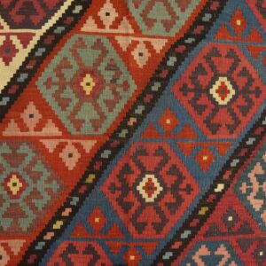 Close-up of geometric diamond patterns in a colorful kilim rug by Rugs On Net