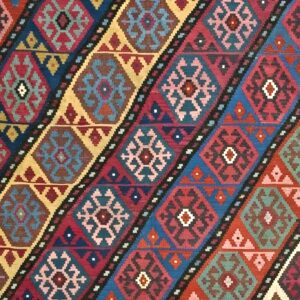 Close-up of diagonal geometric patterns on a colorful kilim rug by Rugs On Net