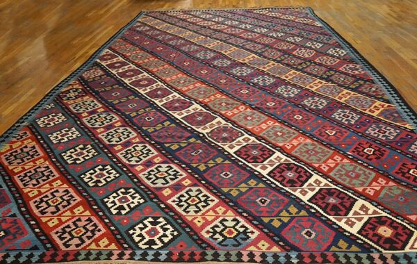 Kilim rug with diagonal stripes and geometric motifs by rugs on net