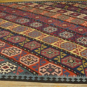 Close-up of a colorful striped kilim rug with geometric motifs by Rugs On Net