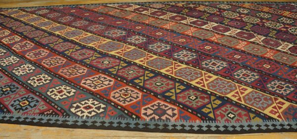 Close-up of a colorful striped kilim rug with geometric motifs by rugs on net