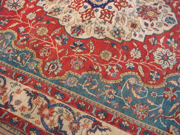 Close-up of the intricate floral pattern and border of the oriental rug by rugs on net. By rugs on net