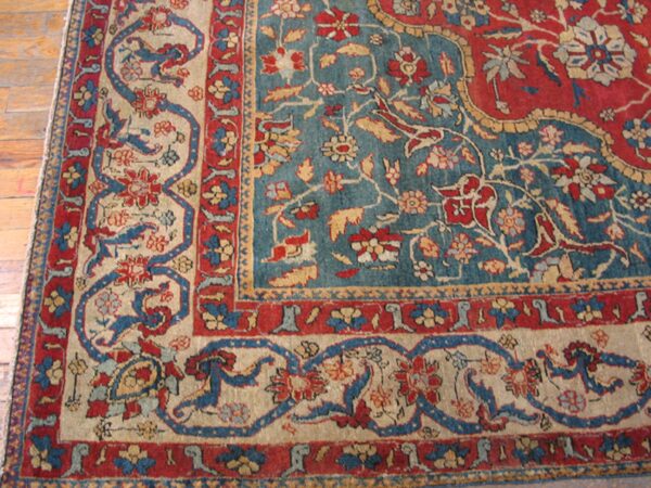 Close-up of a detailed persian rug border with red, blue, and beige elements by rugs on net