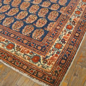 Close-up of a blue and red patterned rug corner by Rugs On Net