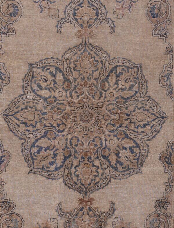 Close-up of a beige and blue traditional medallion rug pattern by rugs on net