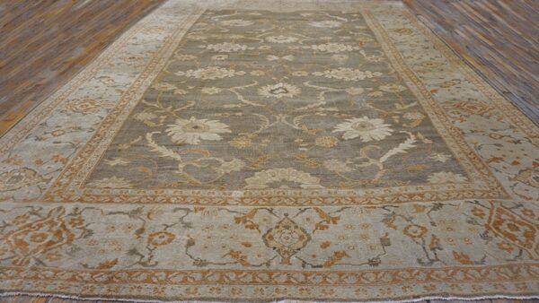 A large, traditional rug in muted sage and tan with floral motifs, by rugs on net. By rugs on net