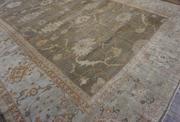 Close-up view of a distressed gray and beige floral pattern rug by rugs on net. By rugs on net