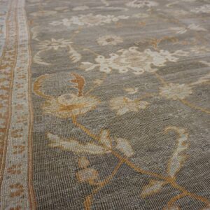 Close-up of a gray and gold floral rug texture by Rugs On Net