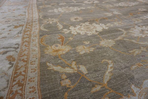 Close-up of a gray and gold floral rug texture by rugs on net