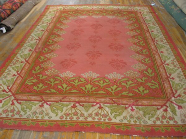 Close-up of a pink and green floral rug design by rugs on net. By rugs on net