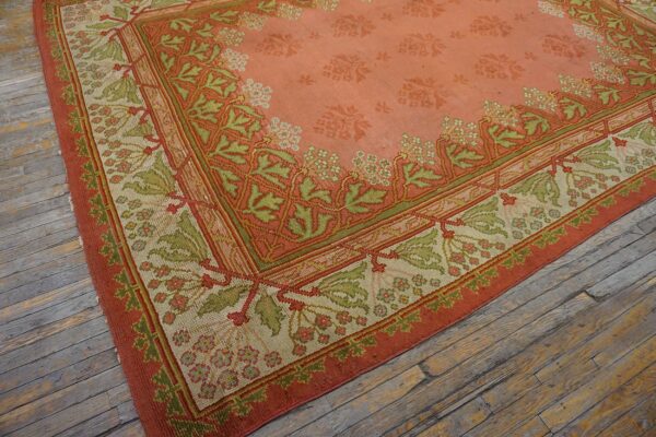 Close-up of the corner of a salmon and green patterned rug by rugs on net