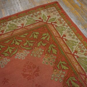 Close-up of a salmon pink rug with green vine borders, by Rugs On Net