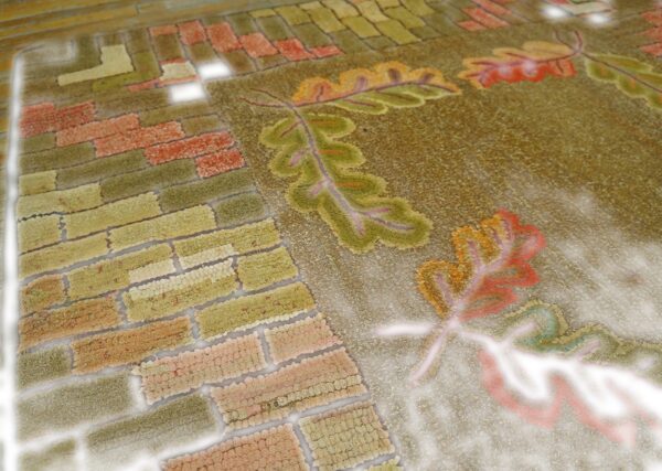 Close-up texture of a rug featuring brickwork and autumn leaves, by rugs on net