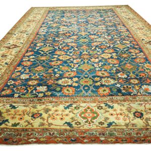 Close-up view of a deep blue and orange floral rug by Rugs On Net. by Rugs On Net