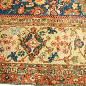 Close-up of a detailed floral border section of an antique rug by Rugs On Net. by Rugs On Net